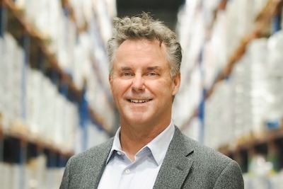 A photograph of Rob Spurgeon standing in the warehouse.