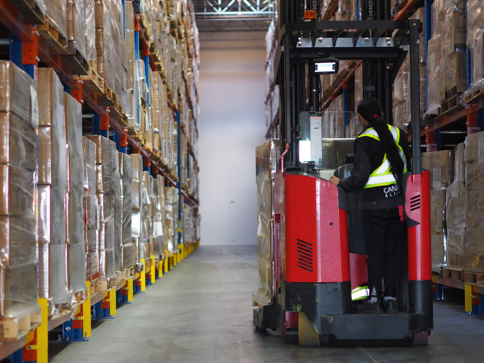 A forklift performs warehousing services.