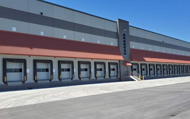 A warehouse is pictured from the outside, demonstrating warehouse management.