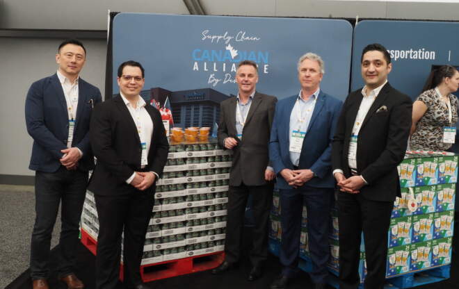The Canadian Alliance team is photographed at a trade show.