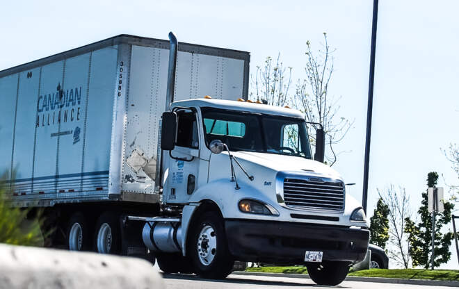 A transport truck demonstrates Canadian and Provincial Transportation Authorities.