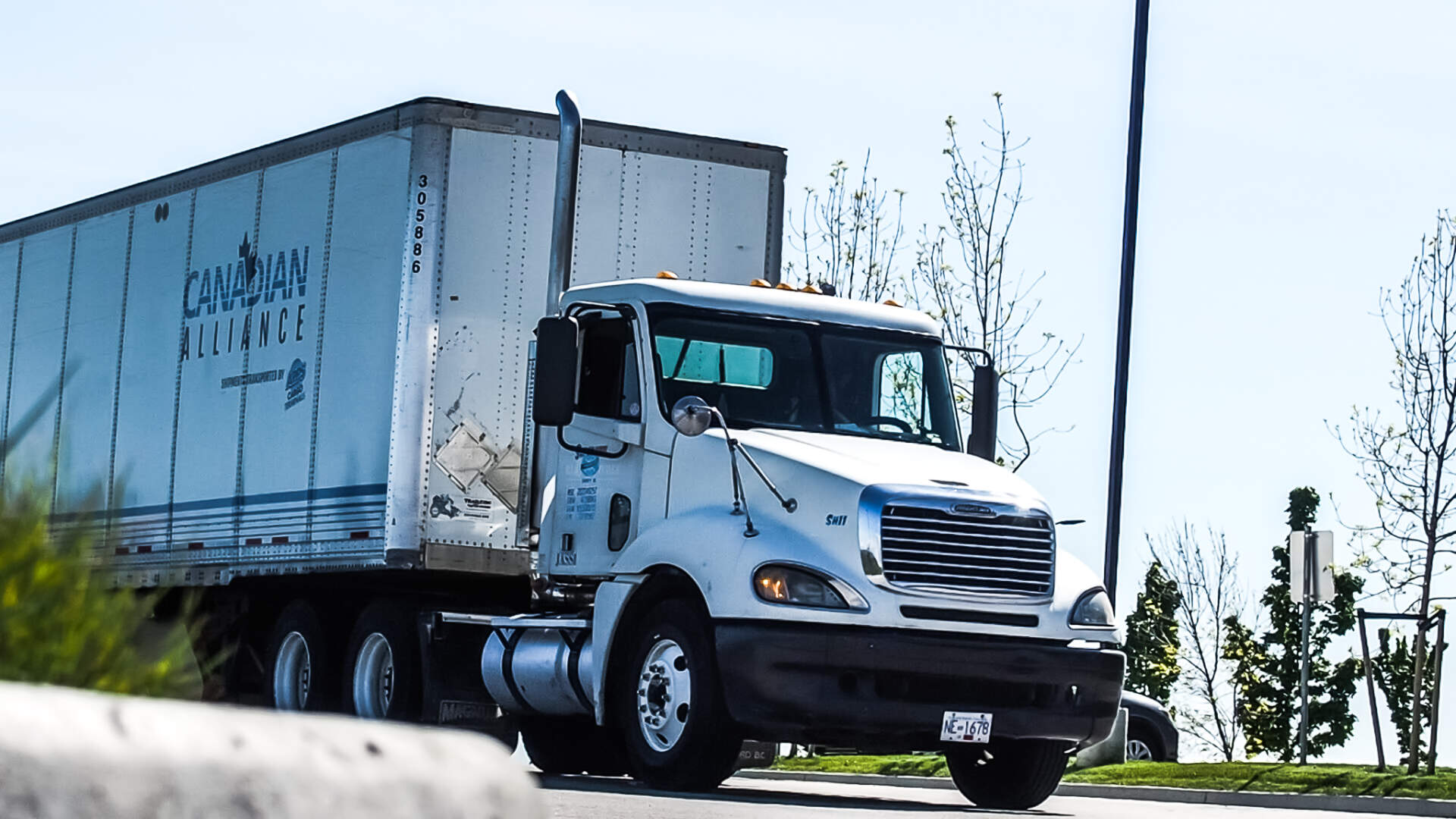 A transport truck demonstrates Canadian and Provincial Transportation Authorities.