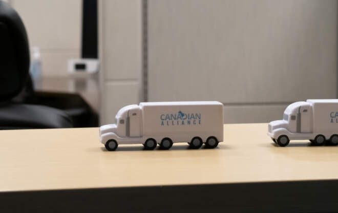 A Canadian Alliance model truck on a desk illustrates a freight brokerage