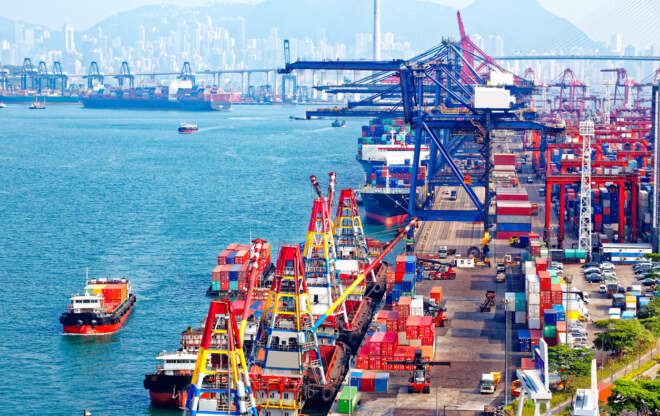 An image of the Port of Vancouver demonstrates international trade.