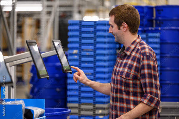 Man doing e-commerce pick and pack system